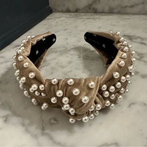 Beige pearl Lele Sadoughi headband.